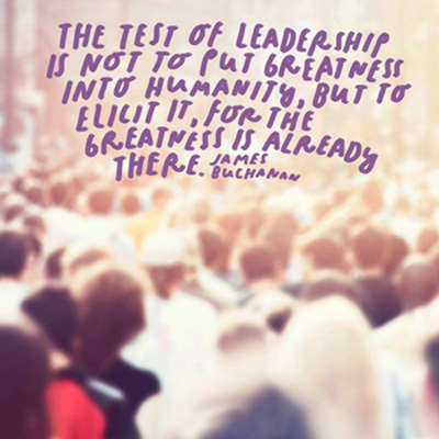 Blurry image of crowd with the text: The test of leadership is not to put greatness into humanity, but to elicit it, for the greatness is already there. - James Buchanan