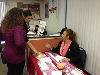 Photo of Lilia, a Promotora de salud, educating women at the Mexican Consulate in Salt Lake City.