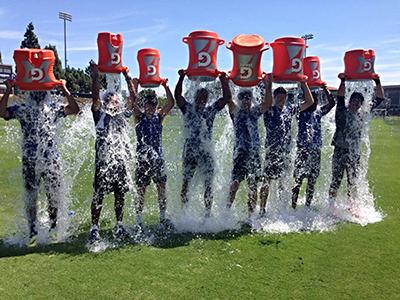 Image of a group of challengers pouring buckets of ice water over their heads.