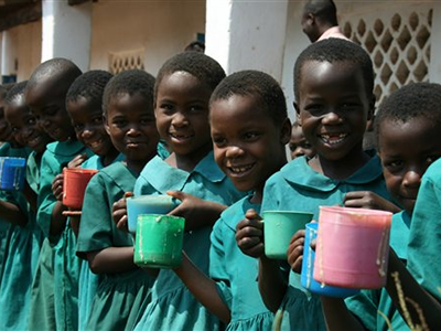 Photo of a group of young schoolgirls enjoying Mary's meals.