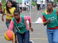 Image of children playing basketball as part of PeacePlayers International- South Africa's "life skills" program